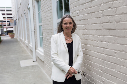 judith romanowski in fron of office building